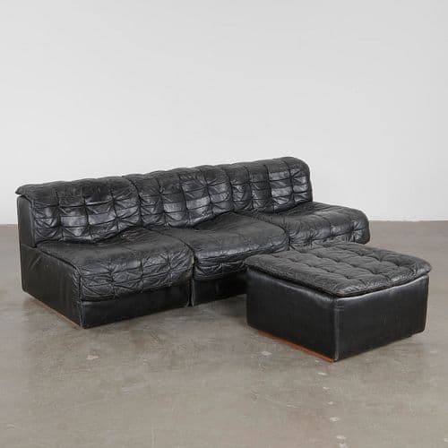 DS-11 Modular Sofa with Ottoman in Patinated Black Leather, Switzerland, 1970s. by De Sede, sold at Circa