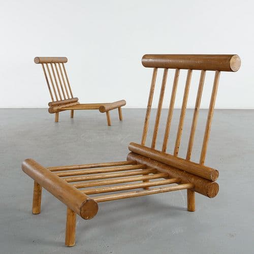 Pair of La Cachette Oak Fireside Chairs by Charlotte Perriand, sold at Circa
