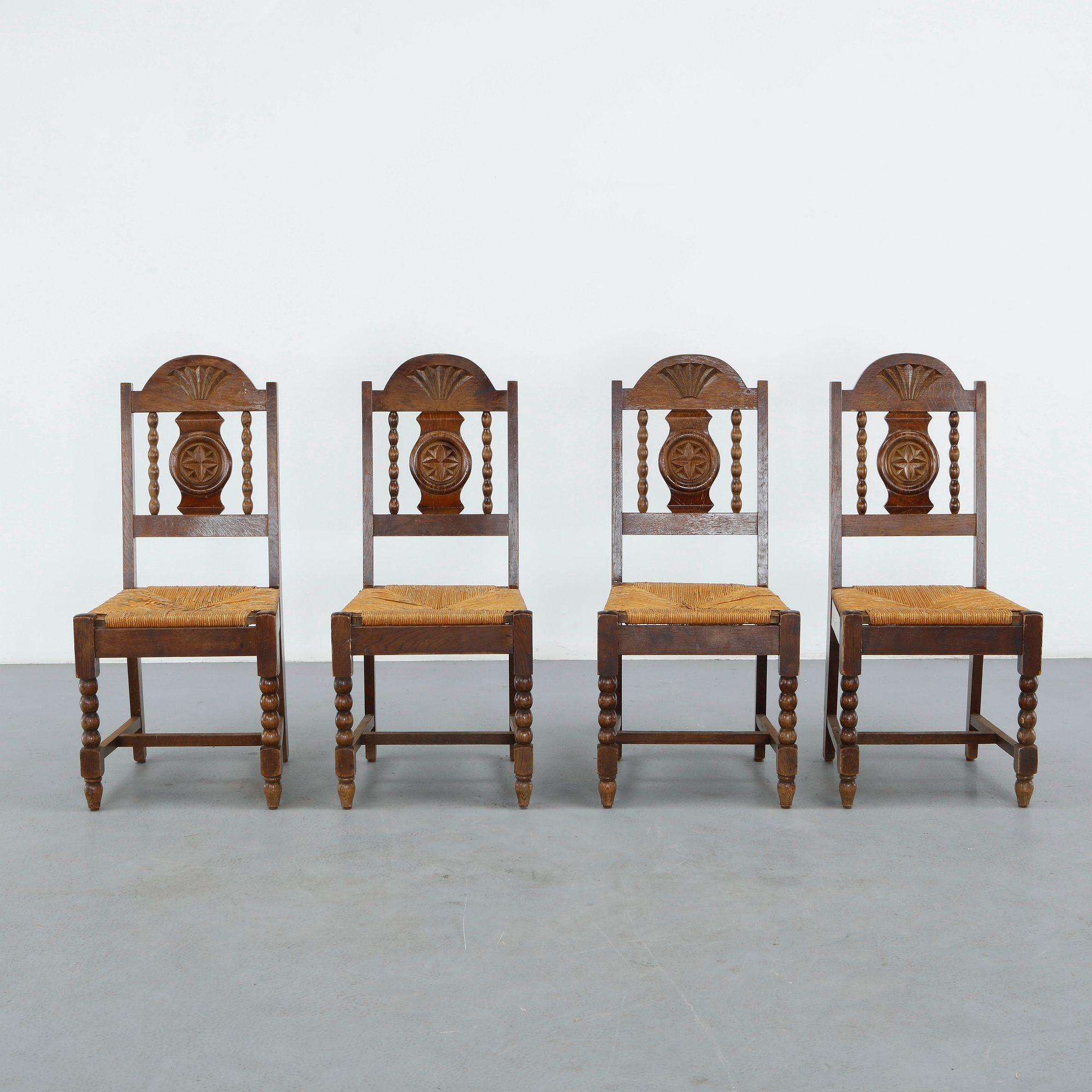 Set of Four Oak Chairs in the style of Charles Dudouyt, 1950s
