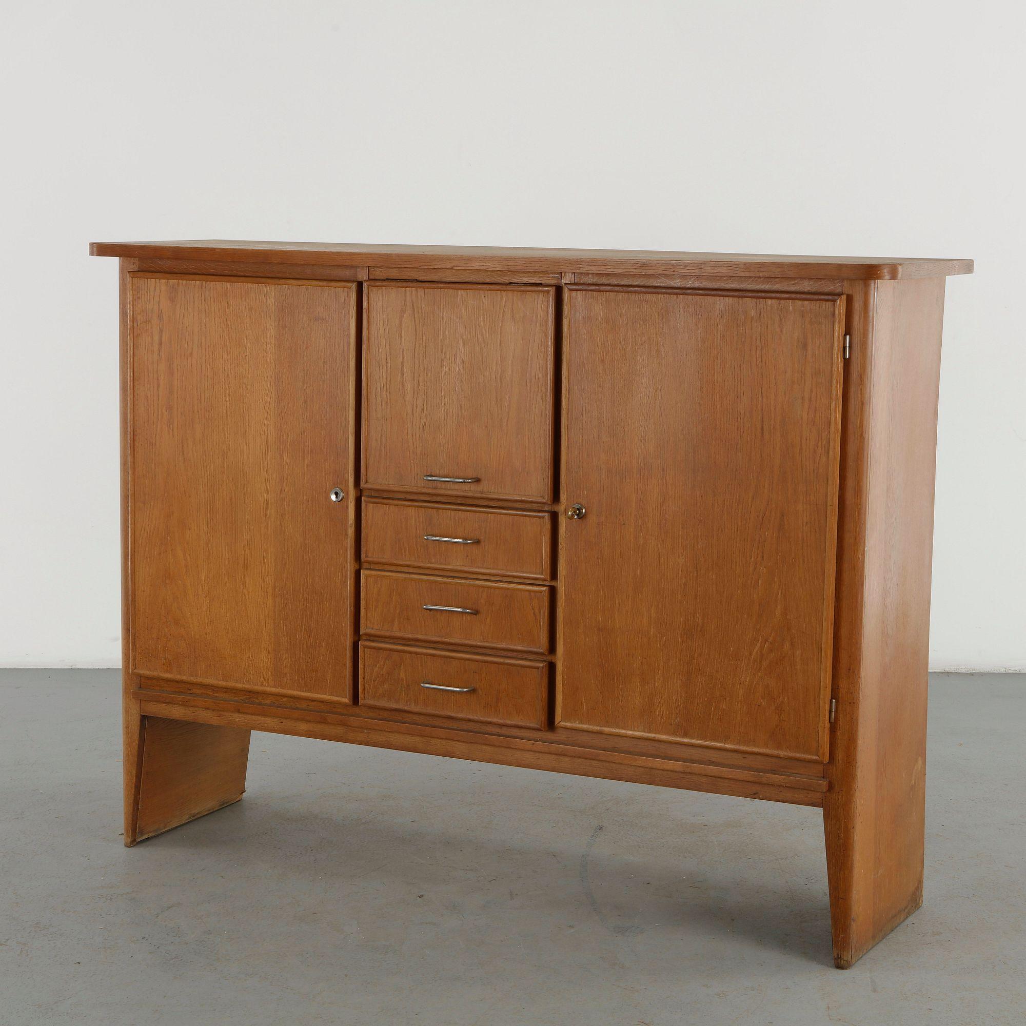 René Gabriel RG202 oak sideboard with three central drawers, flanking doors and cast aluminum pulls